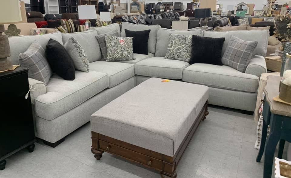 Name-brand sofa on display in the 82 Outlet furniture warehouse